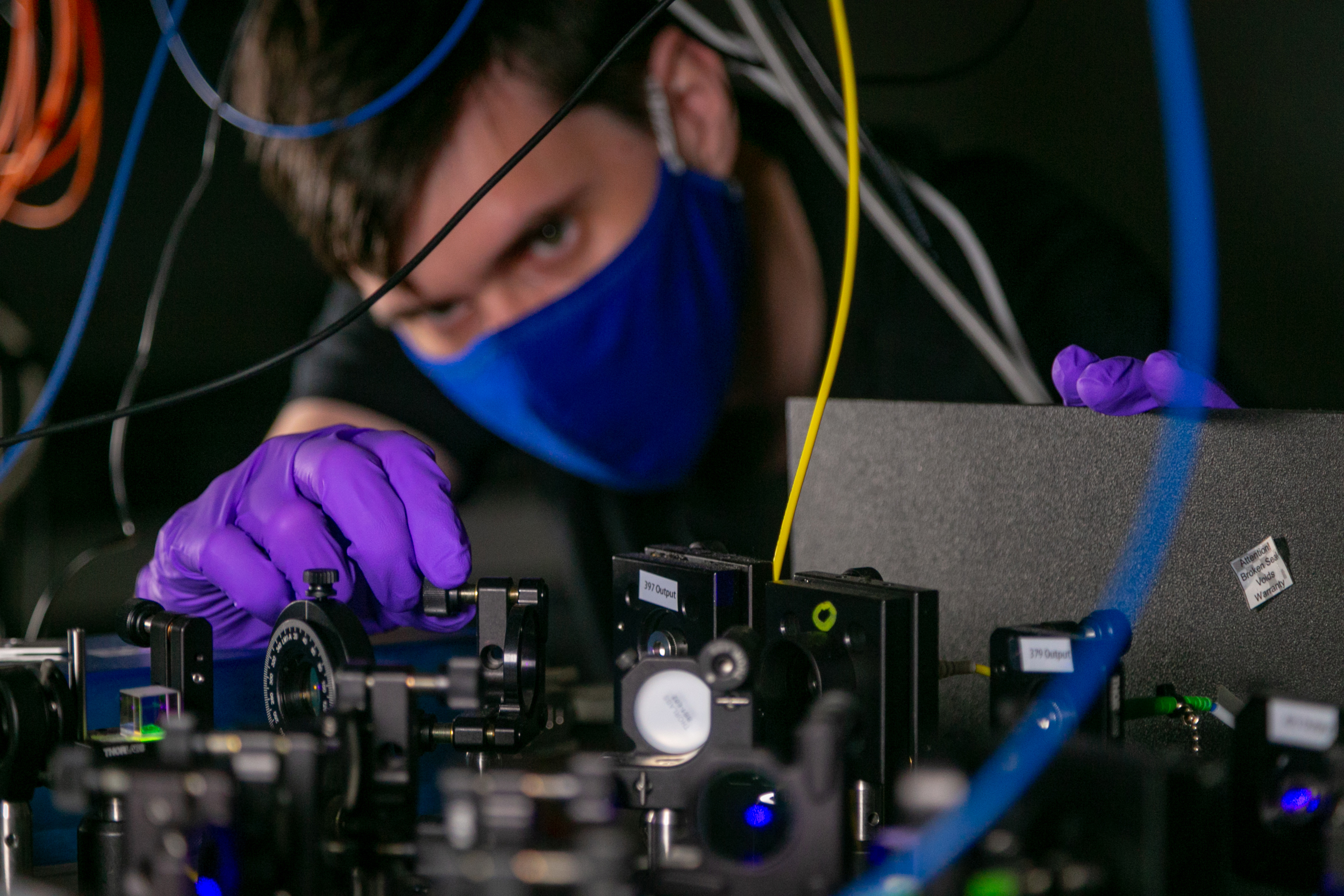 Eric Pretzsch works on a quantum computer setup in the Brown Lab.